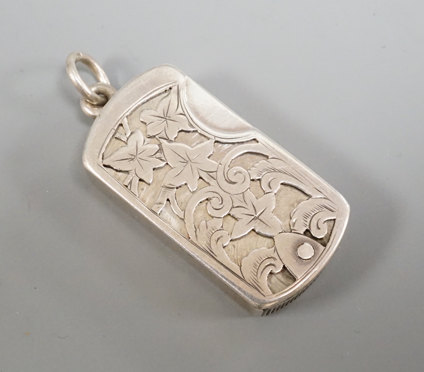 A Victorian swivel action silver vesta case, by Joseph Taylor, Birmingham, 1879, 41mm.